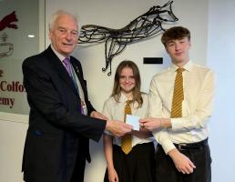 Past President of the Club, Mr Clive Bath, is pictured presenting the book tokens to Poppy and Arturo.
(Oliver was unfortunately not available for the presentation).